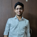 A photo of Hardik in front of a brown background