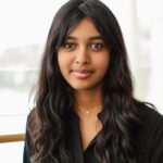 A photo of Manushri with a plain background